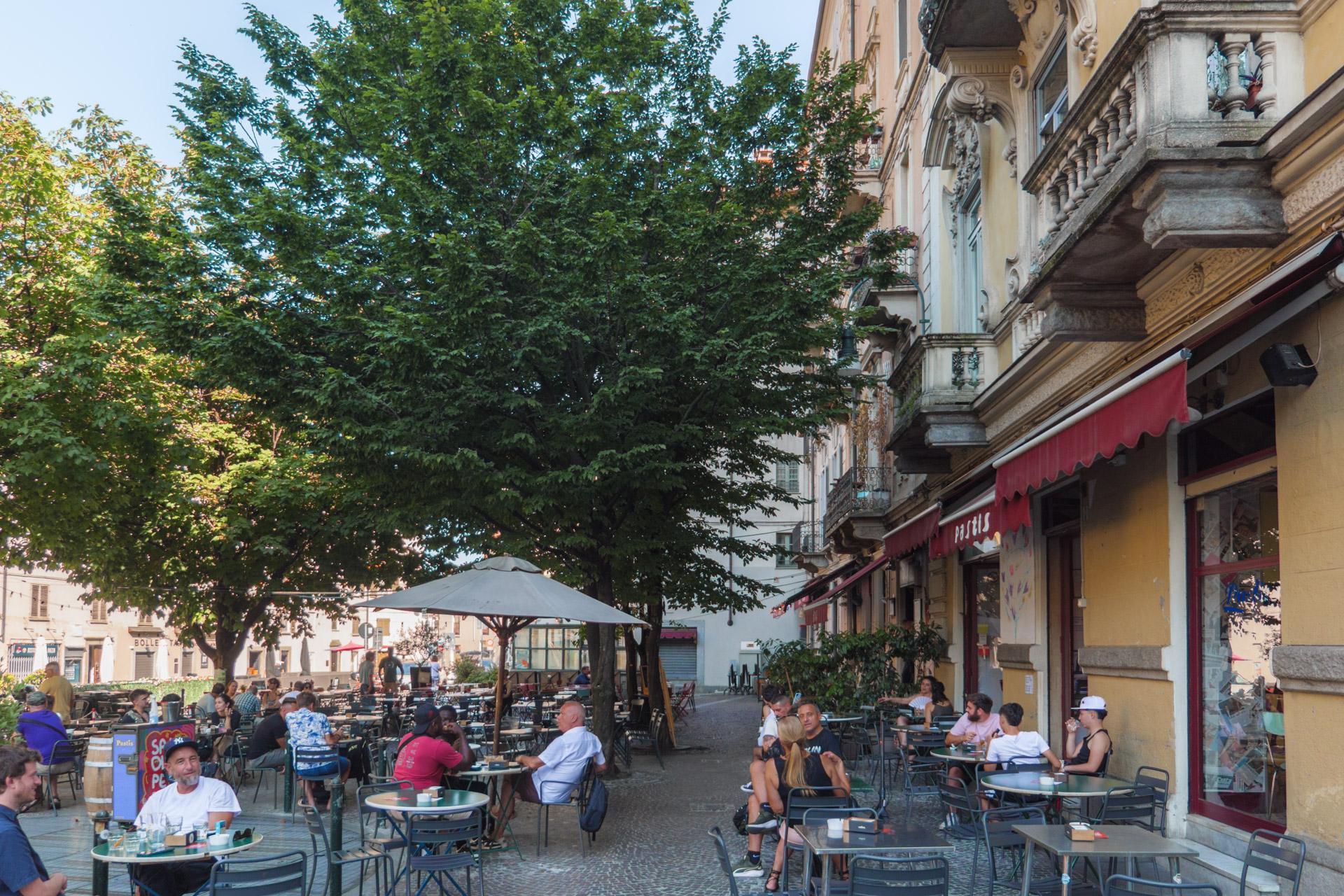 Piazza Emanuele Filiberto, with people sitting at a café