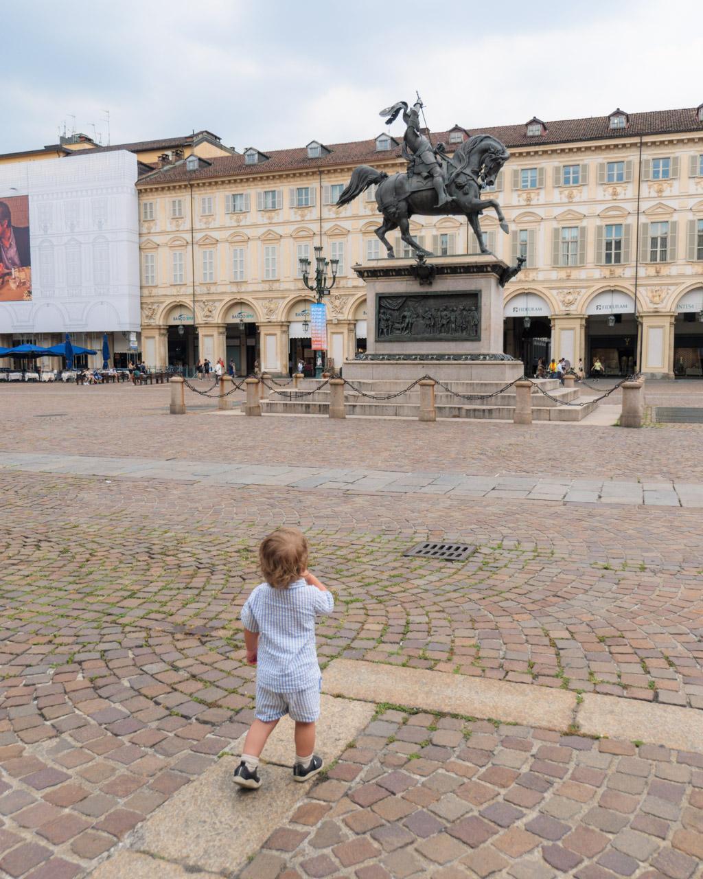 Our toddler son at Piazza San Carlo