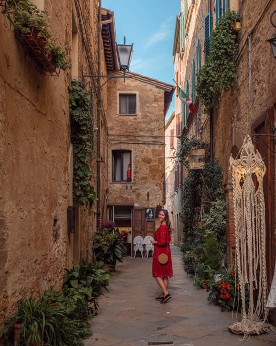 Victoria on a narrow street in Pienza