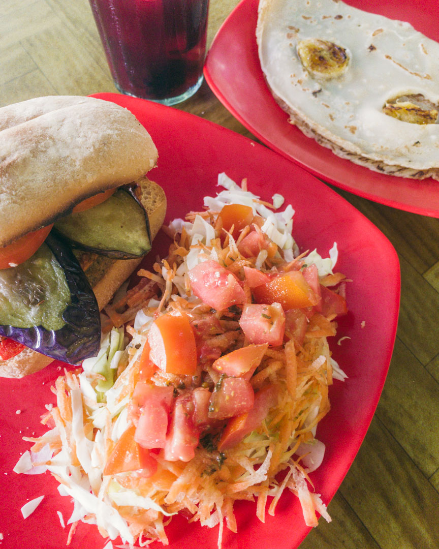 Vegan Tempeh Burger in a ciabatta bun and a banana pancake